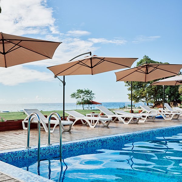 image of a resort pool with umbrellas